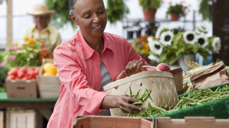 A woman buying vegetables in the market