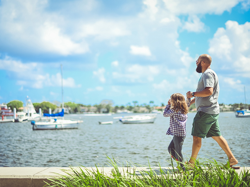 father and daughter walk along